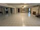 Large common area with tiled floors, fireplace and access to other rooms at 1294 Dogwood Rd, Snellville, GA 30078