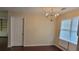 Dining room featuring a chandelier, hardwood floors and natural light at 1294 Dogwood Rd, Snellville, GA 30078
