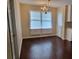 Bright dining room with hardwood floors, windows and chandelier at 1294 Dogwood Rd, Snellville, GA 30078