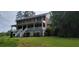 Charming two-story brick home featuring a welcoming front porch with white railing and landscaped yard at 1294 Dogwood Rd, Snellville, GA 30078