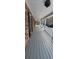 Long, covered porch with white railing at 1294 Dogwood Rd, Snellville, GA 30078