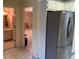 Kitchen features stainless steel refrigerator and access to bathroom at 1294 Dogwood Rd, Snellville, GA 30078