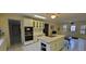 Kitchen with white cabinets, island and appliances at 1294 Dogwood Rd, Snellville, GA 30078