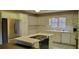 Spacious kitchen with white cabinets and island at 1294 Dogwood Rd, Snellville, GA 30078