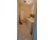 Bright laundry room with white washer and dryer, white cabinets and tile flooring at 1294 Dogwood Rd, Snellville, GA 30078