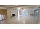 Open-concept living room features tile flooring and brick fireplace with curtains at 1294 Dogwood Rd, Snellville, GA 30078