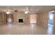 Large living room showcasing tile flooring and a brick fireplace with curtains at 1294 Dogwood Rd, Snellville, GA 30078