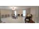 Spacious living room with tiled floors and multiple windows at 1294 Dogwood Rd, Snellville, GA 30078