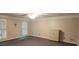 Comfortable room with carpet, shuttered windows, and a cabinet for storage at 1294 Dogwood Rd, Snellville, GA 30078
