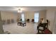 Spacious living room with tiled floors and multiple windows at 1294 Dogwood Rd, Snellville, GA 30078