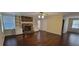 Living room featuring hardwood floors, brick fireplace, and built-in bookshelves at 1294 Dogwood Rd, Snellville, GA 30078