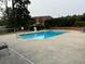 Community swimming pool with lounge chairs at 1294 Dogwood Rd, Snellville, GA 30078