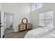 Bedroom with wood dresser and large windows at 2192 Spink St, Atlanta, GA 30318