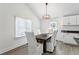 Bright dining room with wood table and white chairs at 2192 Spink St, Atlanta, GA 30318