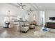 Open concept living and dining area with hardwood floors and stylish furniture at 2192 Spink St, Atlanta, GA 30318