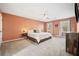 Spacious bedroom with plush carpet, large bed, and calming decor at 3050 Wax Wing Nw Ct, Kennesaw, GA 30144