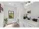 Bright half bathroom featuring modern fixtures, a sleek vanity, and elegant decor at 3076 Kelly St, Scottdale, GA 30079