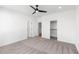 Spacious bedroom with plush carpet, ample closet space, and neutral tones at 3076 Kelly St, Scottdale, GA 30079