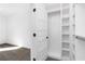 Walk in closet with open door and shelving at 3076 Kelly St, Scottdale, GA 30079