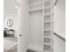 Spacious walk-in closet with custom shelving and ample storage space at 3076 Kelly St, Scottdale, GA 30079