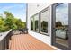 Wood deck with black railings and siding plus wooded view at 3076 Kelly St, Scottdale, GA 30079