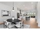 Dining area features a modern table setting, stylish chairs, and a view of the living area at 3076 Kelly St, Scottdale, GA 30079