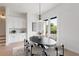Inviting dining area features a modern table setting, stylish chairs, and outdoor access at 3076 Kelly St, Scottdale, GA 30079
