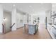 Open-concept kitchen with white cabinets, an island, and stainless steel appliances at 3076 Kelly St, Scottdale, GA 30079