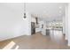 Open kitchen and living area featuring stainless steel appliances and a large center island at 3076 Kelly St, Scottdale, GA 30079