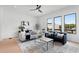 Stylishly decorated living room with a modern rug, comfortable seating, and plenty of natural light at 3076 Kelly St, Scottdale, GA 30079