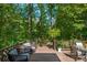 Relaxing deck with wooded backdrop and comfortable seating at 10 Bohler Nw Mews, Atlanta, GA 30327