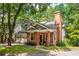 Charming brick home with attached garage and lush landscaping at 10 Bohler Nw Mews, Atlanta, GA 30327