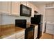 Kitchen with black appliances and granite countertops at 1114 Mcclelen Way, Decatur, GA 30033