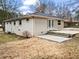 Charming home featuring an outdoor patio with a large grassy backyard surrounded by mature trees at 2771 Ridge Park Dr, Tucker, GA 30084