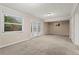 A carpeted basement room with a window and a door offers space for various activities at 2771 Ridge Park Dr, Tucker, GA 30084