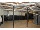 Spacious unfinished basement with ceiling insulation and supporting beams at 2771 Ridge Park Dr, Tucker, GA 30084