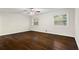A well-lit bedroom features wood flooring and large windows that allow natural light at 2771 Ridge Park Dr, Tucker, GA 30084