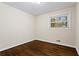 Cozy bedroom with hardwood floors and bright natural light from the window at 2771 Ridge Park Dr, Tucker, GA 30084