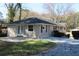 Charming home featuring an outdoor patio with a large grassy backyard surrounded by mature trees at 2771 Ridge Park Dr, Tucker, GA 30084