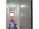 Hallway with hardwood floors leads to rooms with natural light streaming through the windows at 2771 Ridge Park Dr, Tucker, GA 30084