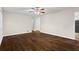 A bright living room featuring hardwood floors, and fresh paint, with access to other rooms at 2771 Ridge Park Dr, Tucker, GA 30084