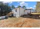 Single story white house with detached shed and wooden stairs at 4064 Post Rd, Winston, GA 30187