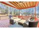 Relaxing covered deck with seating area and wooded views at 569 Alexander Farms Sw Vw, Marietta, GA 30064