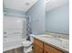 Bathroom with tub, shower, granite countertop, and wood vanity at 6207 Willowbrook Dr, Riverdale, GA 30296
