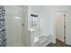 Bathroom features a bathtub, shower, and window at 6207 Willowbrook Dr, Riverdale, GA 30296