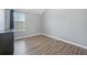 Charming bedroom with wood-look floors and a window at 6207 Willowbrook Dr, Riverdale, GA 30296