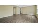 Large bedroom with hardwood floors and neutral walls at 6207 Willowbrook Dr, Riverdale, GA 30296