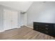 Well-lit bedroom with wood-look floors and double doors at 6207 Willowbrook Dr, Riverdale, GA 30296