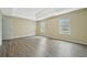Bright bedroom with hardwood floors and neutral walls at 6207 Willowbrook Dr, Riverdale, GA 30296