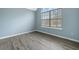 Bedroom with wood-look floors and an arched window at 6207 Willowbrook Dr, Riverdale, GA 30296